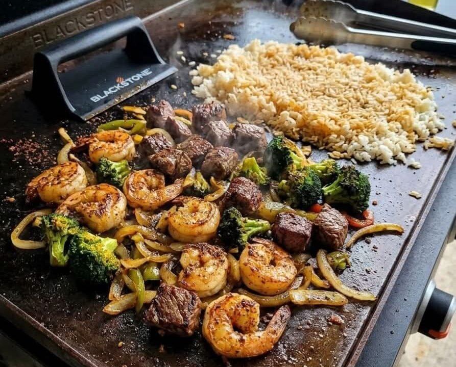 Blackstone griddle cooking smash burgers, fried rice, vegetables, pancakes, and other easy Blackstone recipes outdoors