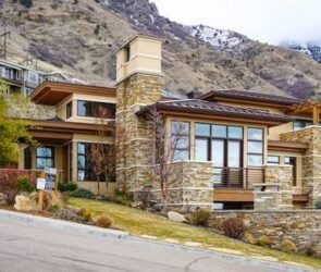 Modern single-family homes for sale in Utah with mountain views and suburban neighborhood streets.