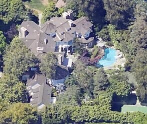 "Front exterior view of a luxury-style home representing Adam Sandler's private Los Angeles residence in Pacific Palisades."