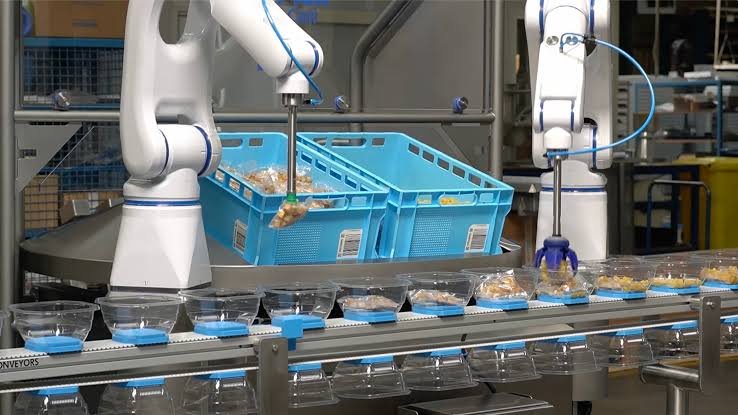 Smart food processing facility using automated robots, conveyor systems, IoT sensors, and digital dashboards to optimize the foodtech automation supply chain.