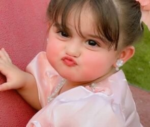 Person with pouted lips demonstrating the meaning of the word "pouted" through facial expression.
