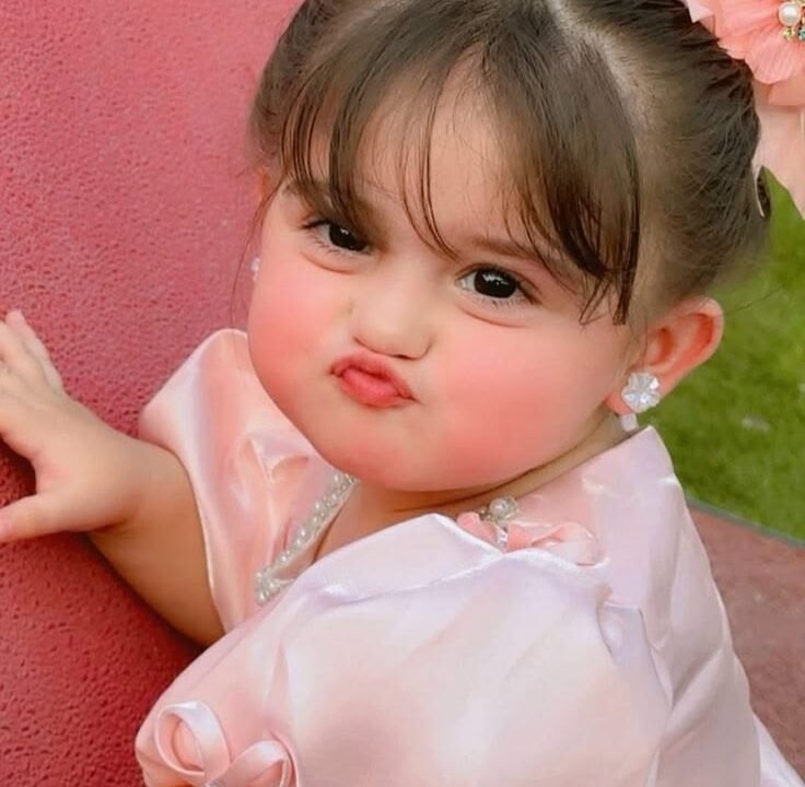 Person with pouted lips demonstrating the meaning of the word "pouted" through facial expression.