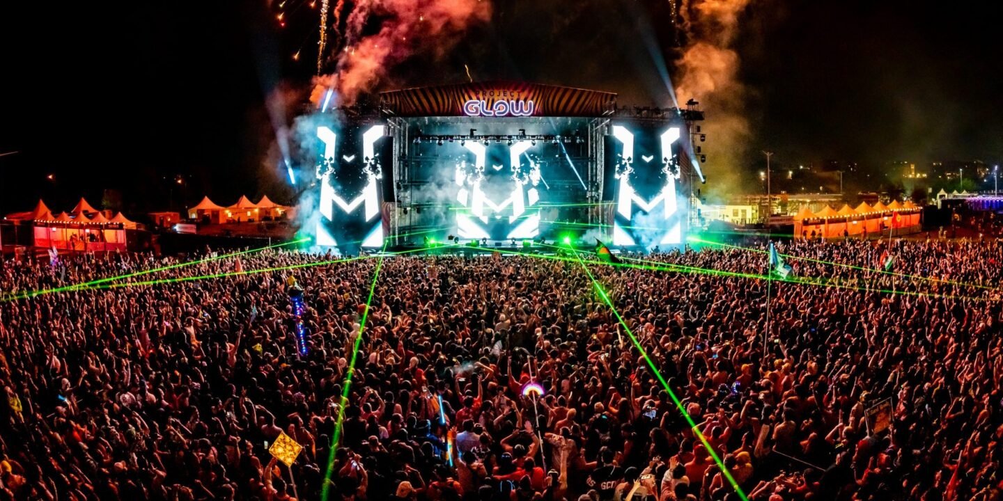 Crowds enjoying live performances and colorful stage production at Project Glow 2025 in Washington, D.C.