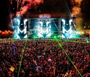 Crowds enjoying live performances and colorful stage production at Project Glow 2025 in Washington, D.C.