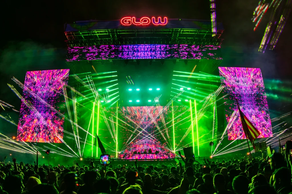 Crowds enjoying live performances and colorful stage production at Project Glow 2025 in Washington, D.C.