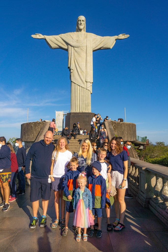 People enjoying Sundays in Rio with families relaxing on Ipanema Beach, cyclists along the waterfront, and a vibrant local market in Rio de Janeiro.