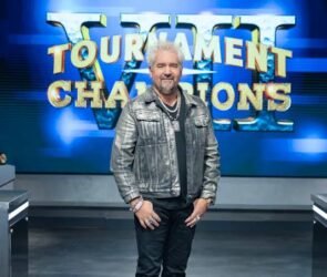 Guy Fieri hosting Tournament of Champions Season 7 cooking competition with chefs competing in a kitchen arena.