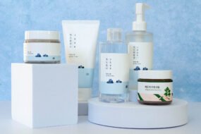 Round Lab Korean skincare products including Dokdo Toner, Birch Juice Moisturizing Cream, cleanser, and sunscreen arranged on a clean white background