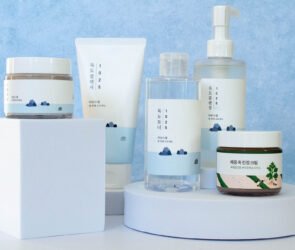 Round Lab Korean skincare products including Dokdo Toner, Birch Juice Moisturizing Cream, cleanser, and sunscreen arranged on a clean white background