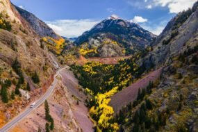 Panoramic view of Colorado's Million Dollar Highway winding through the San Juan Mountains near Red Mountain Pass