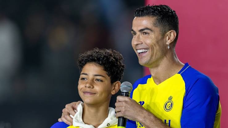 Cristiano Ronaldo Jr playing football during a youth academy match while developing his skills as a young forward.