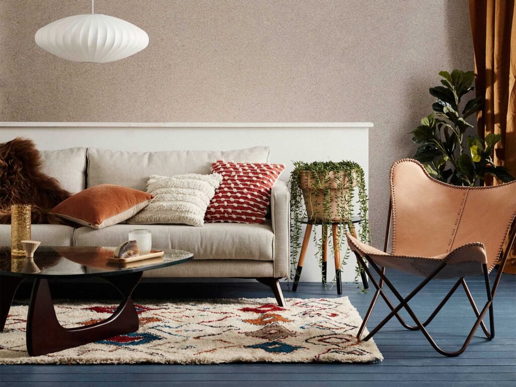 How to decorate a small living room with space-saving furniture, neutral colors, floating shelves, and natural lighting