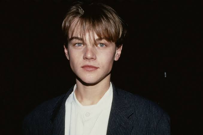 Young Leonardo DiCaprio in a cinematic collage of 1990s portraits showcasing his early Hollywood career.